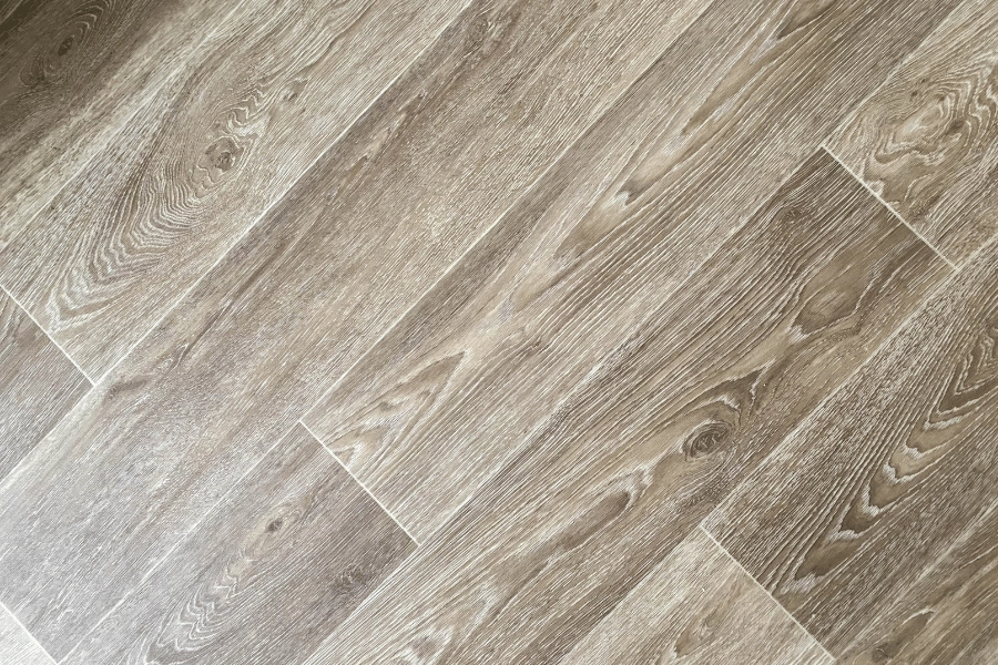 modern beige vinyl flooring with a wood design and texture